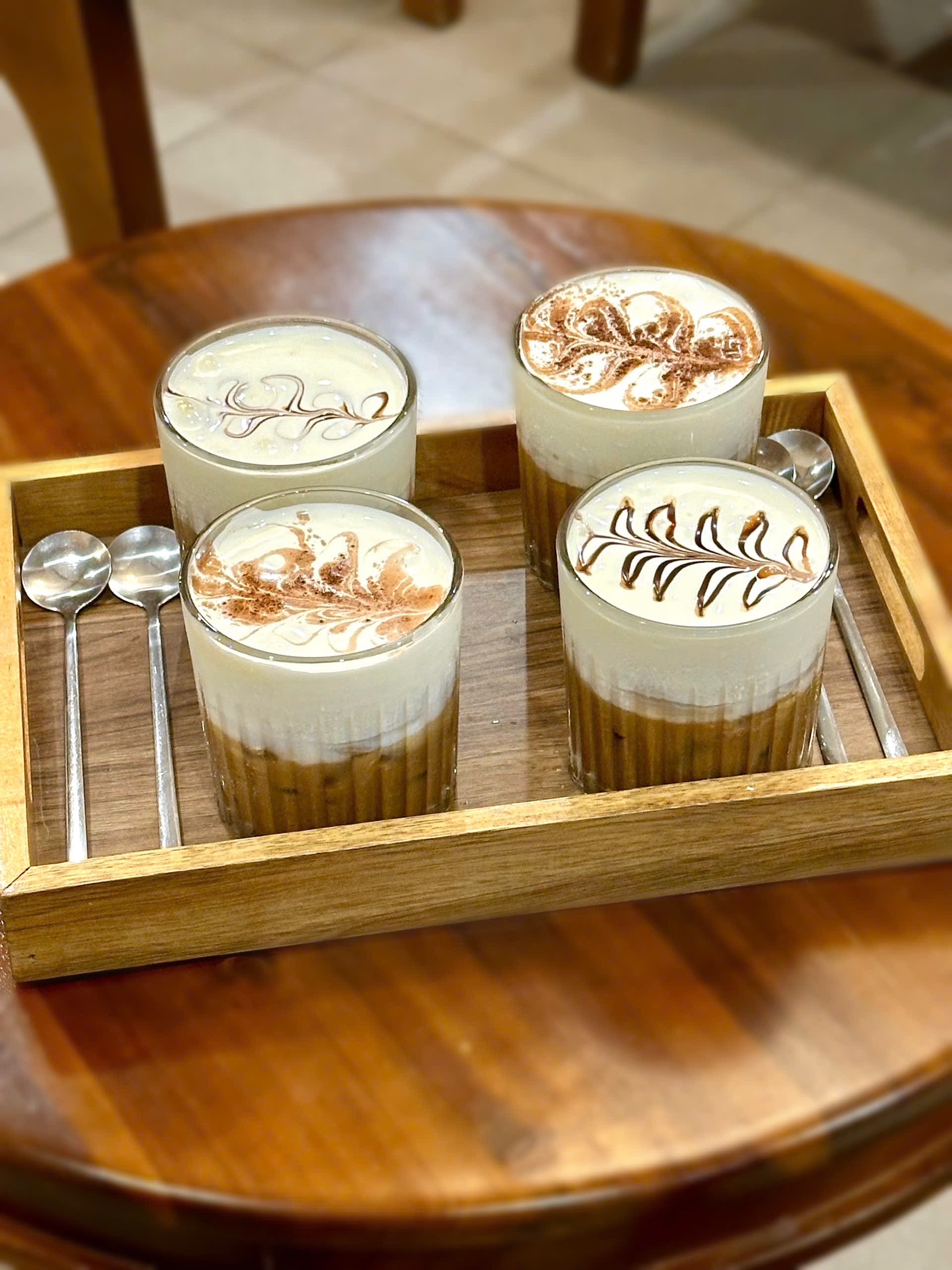 Four decorated Vietnamese coffees