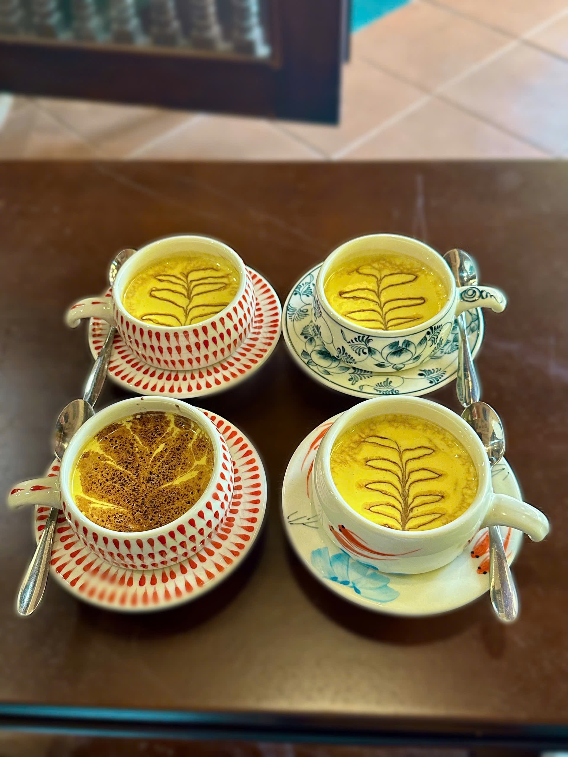 Four egg coffees in ceramic cups